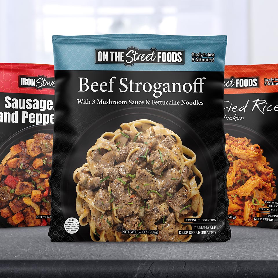 Packaging design for On the Street brand heat-and-serve meals. 3 flavors showing.